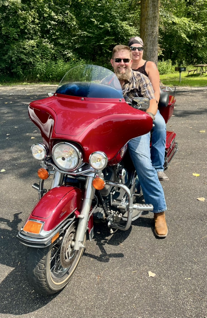 Photo of Wilk and Monika Wilkinson on a motorcycle