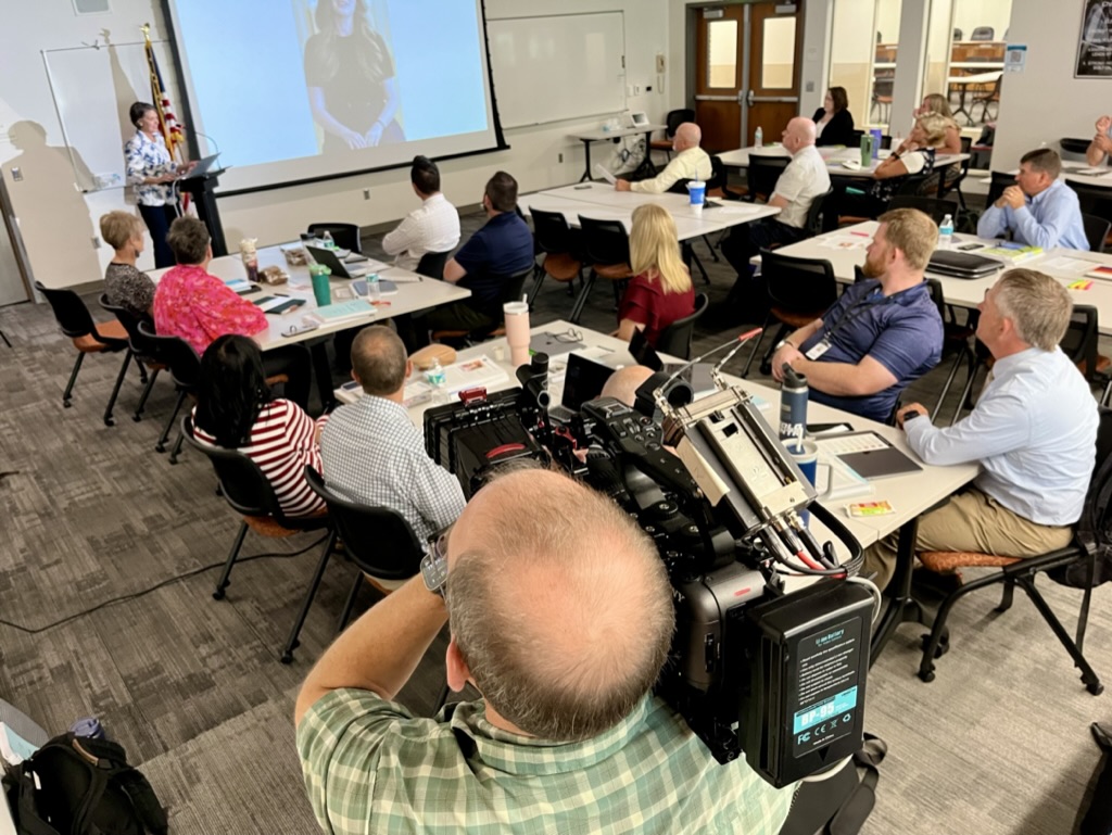 Photo of Tami Pyfer talking to educators